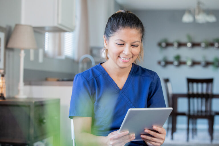 Nurse or doctor works remotely from home video chatting with patients