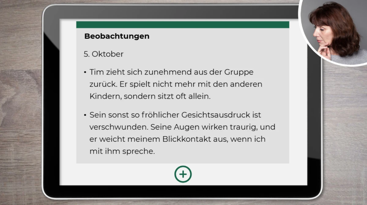 Tablet zeigt Beobachtungsnotizen zu Kind mit Rückzug und Traurigkeit